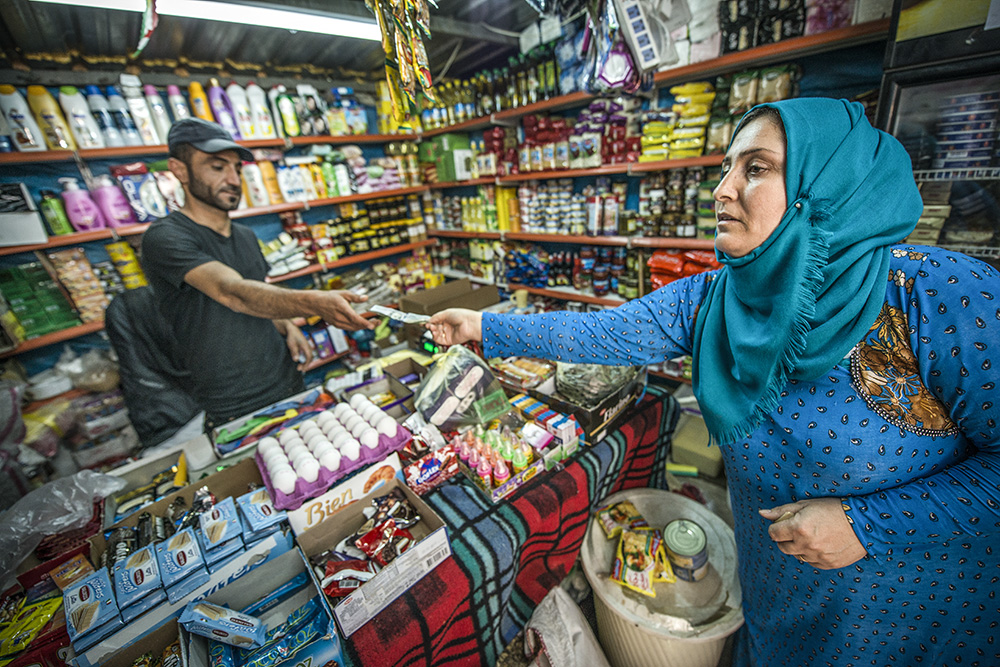 Turkish woman paying for goods