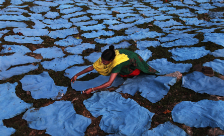 A woman is laying leather out to dry. Credit: United Nations/UN Women/Rashid Probal