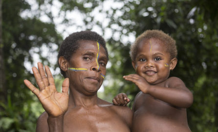 Tanna, Republic of Vanuatu, July 12th, 2014, Indigenous mother with her child in her arms