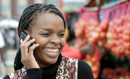 African or black American woman calling on mobile cellphone telephone