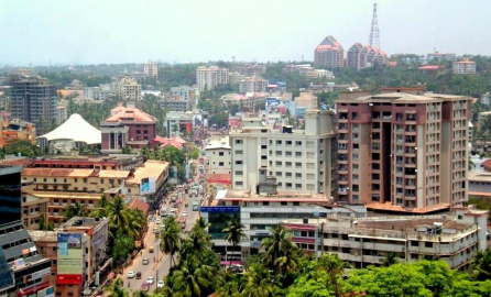 Panoramic photo of Managalore city with several residential buildings, one green area and other buildings 