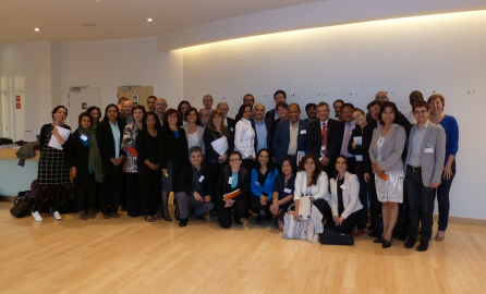 Photo of a group in a room after a conference