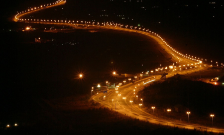 Photograph of a lit-up road at night