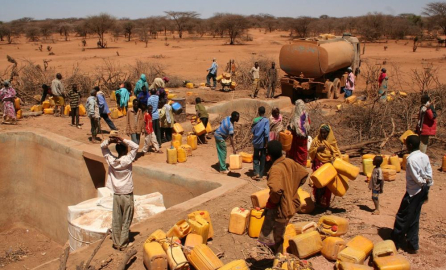 decorative image of villagers picking up water in water distribution campaign