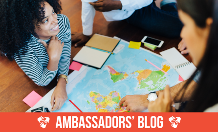 Group of friends looking at the map of the world