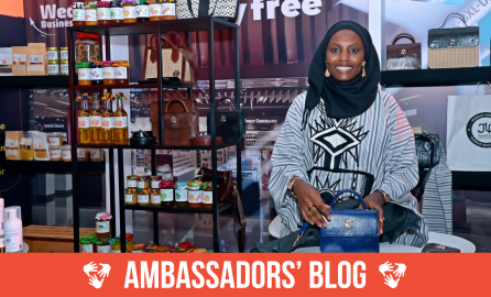 African woman smiling in a shop
