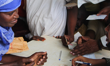 A woman works on registration procedures