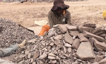 Women breaking stones