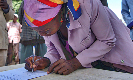 Woman signing a contract
