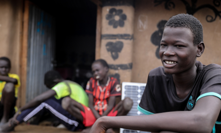 Youths waiting close to a building