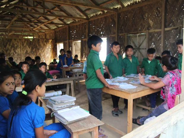 Teacher Sangpui Rose Merry Lusai is teaching some students of an individual class at School.                           Picture :