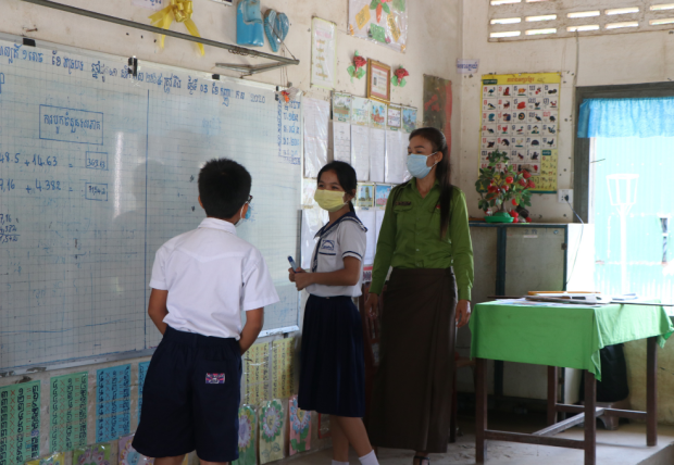 Learners and teacher in a TIGER project school in Battambang province, Cambodia.