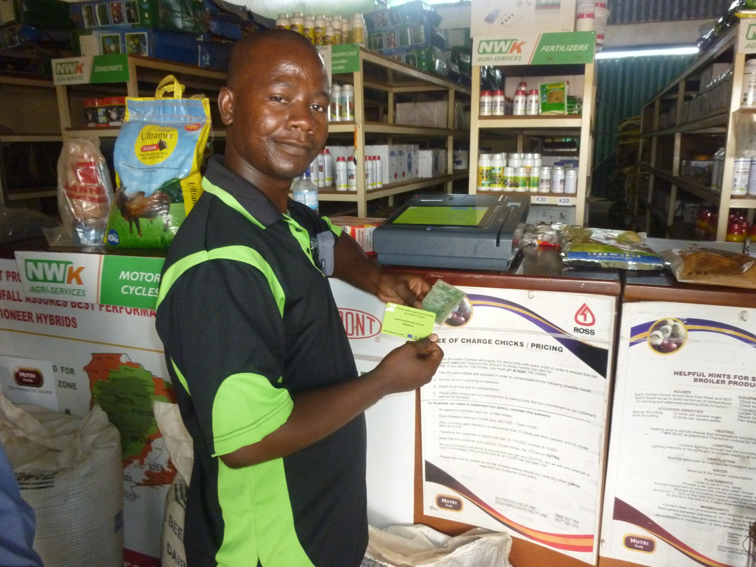 In a visit to the agro-dealer, farmers pick up their free agricultural goods, courtesy of the CASU project.