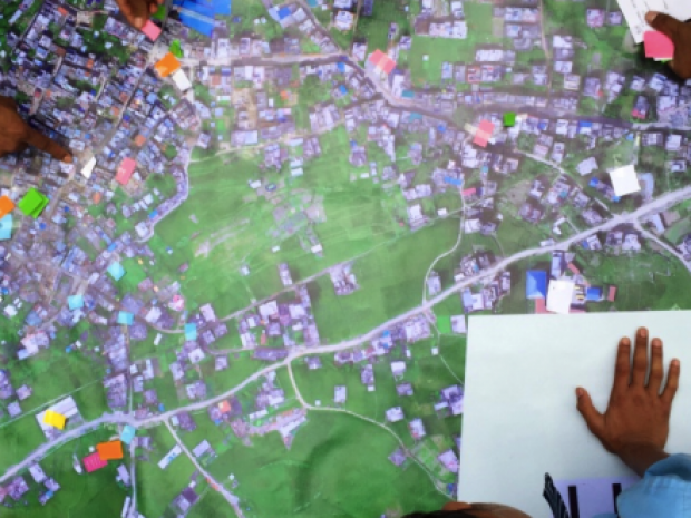 Figure 4 Community mapping. Working with the hardcopy map. Credit: Patrick Meier