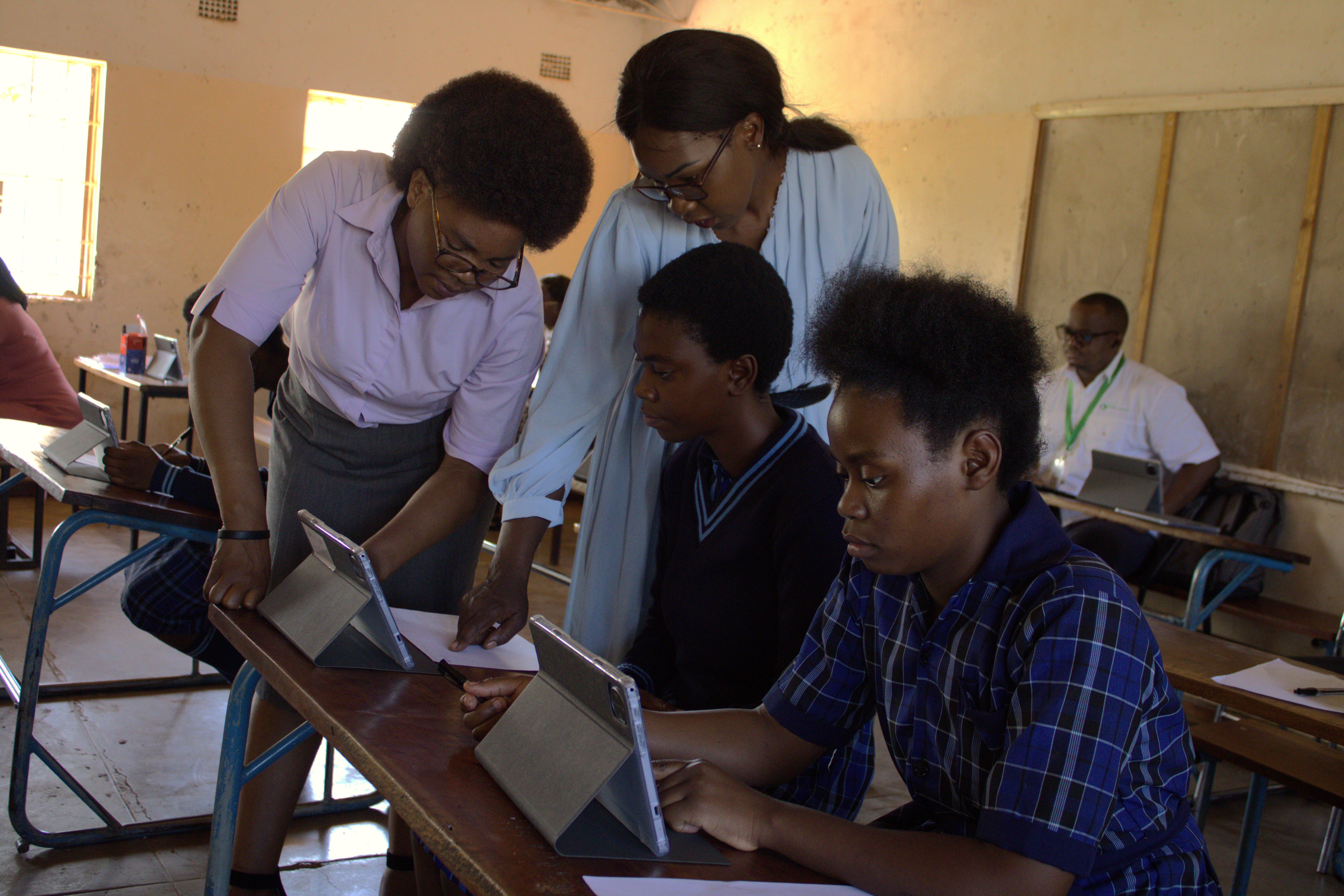 Students working with tablets in a classroom