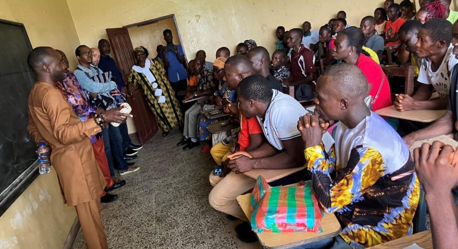 Assistant Minister Mr. Clifford Konah and the team speaking with first-year teacher students at the Kakata Teacher Training Institute.