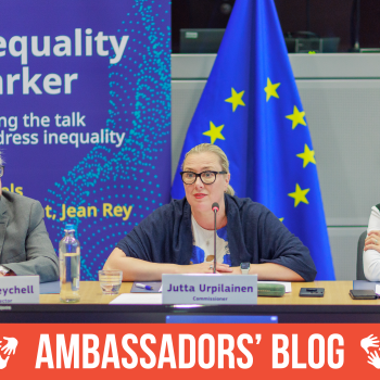 Martin Seychell , Erica Gerretsen , Jutta Urpilainen at a table, with a banner displayed prominently behind them.