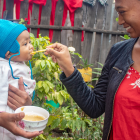 Child being fed in Antananarivo, Madagascar