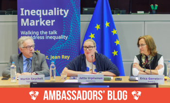 Martin Seychell , Erica Gerretsen , Jutta Urpilainen at a table, with a banner displayed prominently behind them.