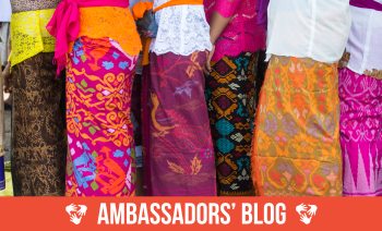 A queue of women wearing colourful traditional dresses