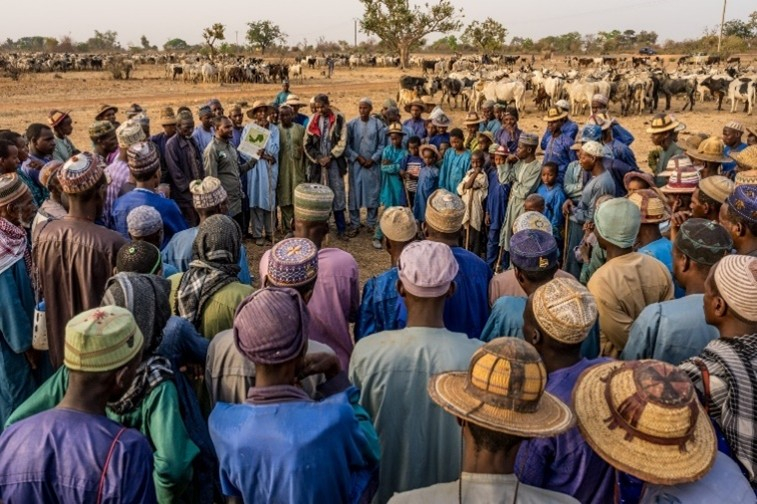 Large group of people standing in a circle